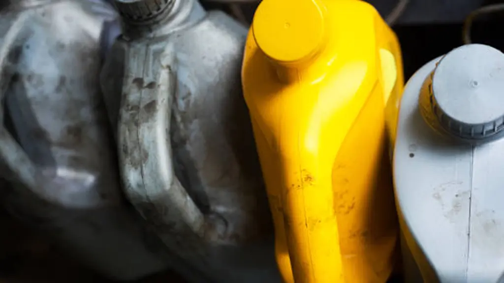 Four motor oil canisters in auto repair shop