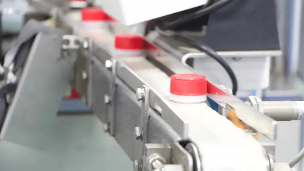 plastic screw cap in manufacturing line