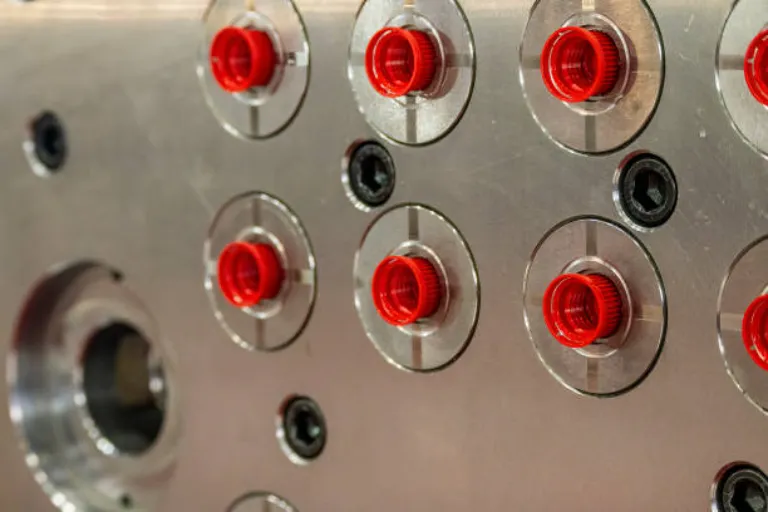 The close up scene of the red plastic screw cap from injection process